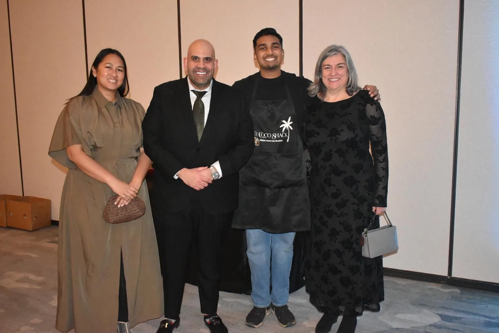 Andrew, the owner of The Coco Shack, with a group of clients at an evening event